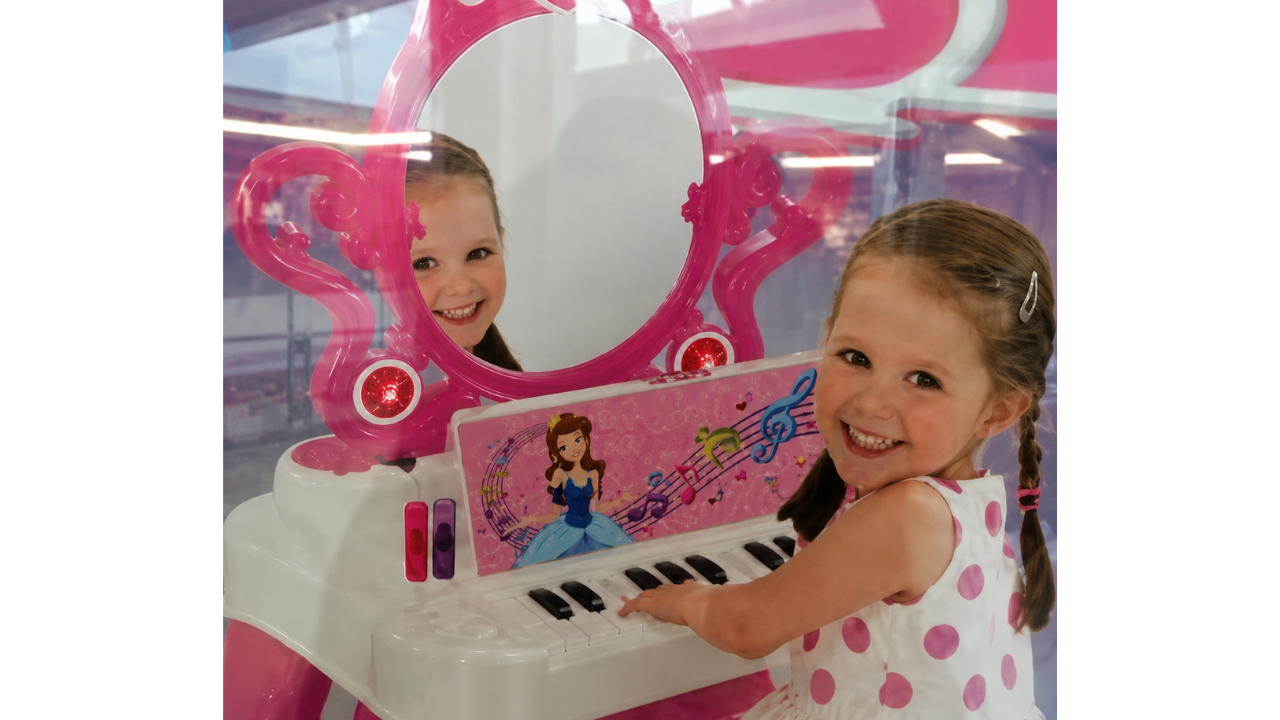 2. Toy piano reflection with two faces