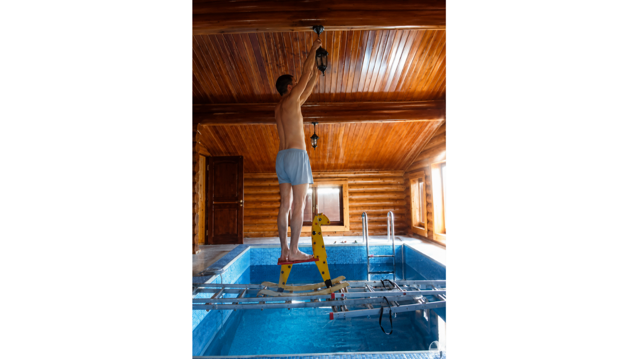 12. DIY Maintenance Over a Swimming Pool
